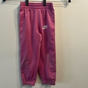 Girls NIKE pink tracksuit pants. Size 3-4t